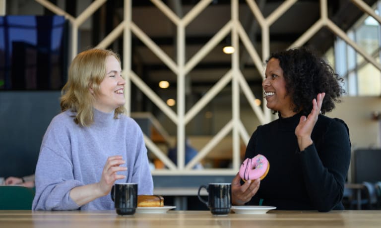 Two women at a service station having coffee