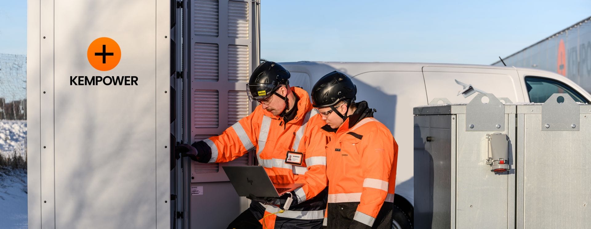 Two Kempower installers working on an EV charger upgrade